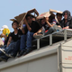 Central American immigrants sit atop the so-called La Bestia (The Beast) cargo train, in an attempt to reach the Mexico-U.S. border, in Arriaga, Chiapas state, Mexico, on July 16, 2014.
Elizabeth Ruiz/Getty Images